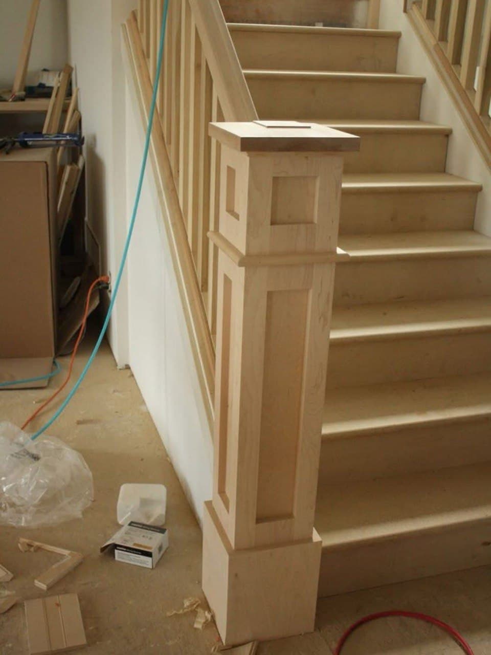 Custom wood newel post and stairs by Rahimi Custom Construction in Knoxville, TN