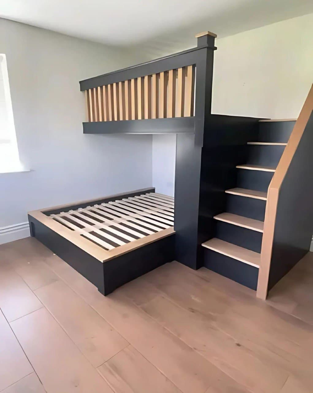 One-off custom two-story loft bed with integrated stairs built to fit the room in Knoxville, TN